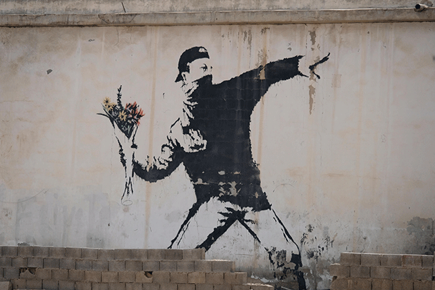 Exploring Love is in the Air by Banksy