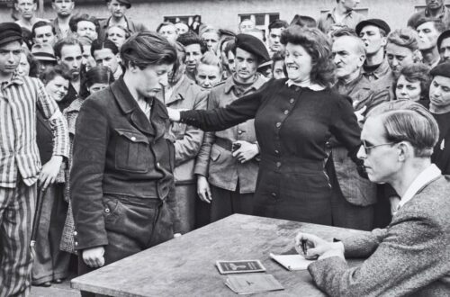Exploring Gestapo Informer Recognized by a Woman by Henri Cartier-Bresson