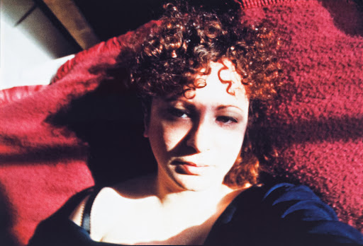 Exploring Self-portrait with Eyes Turned Inward by Nan Goldin