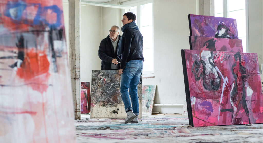 Robert in his studio surrounded by his artworks