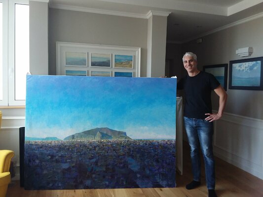 Luca Raimondi in the Studio: at my studio with a landscape painting ready for a new home