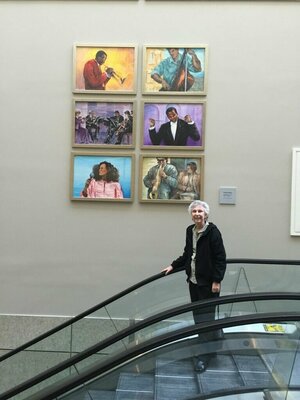 Pauline Ender in de studio: Standing by my paintings purchased by the Detroit convention center.