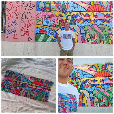 Rosario Annunziata im Studio: Il murales è stato realizzato in collaborazione con istituzioni pubbliche per promuovere l'inclusione . Si vede il dettaglio della stampa sulla t-shirt