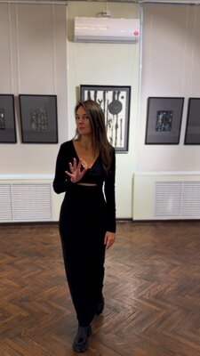 Elena Furgal in de studio: Collective exhibition "Christmas Exhibition". December 2024. Me in the background of my works: "Catharsis" and the "Japanese Poetry" series.