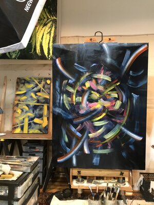 Mark LaRiviere nello studio: I hang my large paintings from overhead iron heating system pipes using bicycle hooks while I'm not actively working on them.