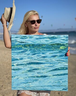 Ulyana Korol in the Studio: Discovering the lace of light reflections in the water...(Ulyana with her work “Threads of Ariadna2” on the Atlantic coast