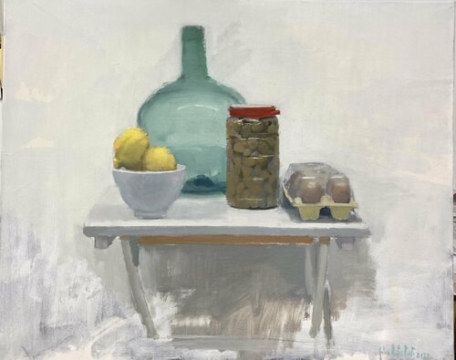 Bodegón. Botella , limones, aceitunas, huevos en la mesa. Antonio Mateos Prieto