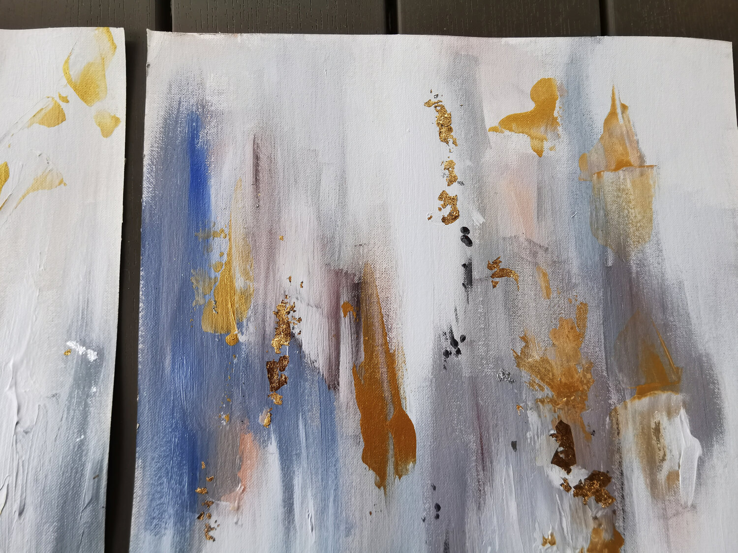 Abstract painting on canvaspaper. Shining gold leaf mixed medium