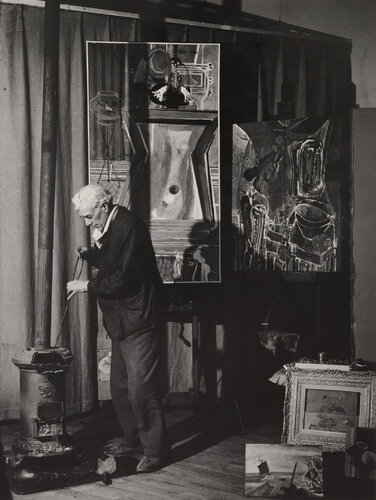 Braque au poêle, Derrière, Le Billard, rue de Douanier (Braque by his stove, his painting Le Billard behind, Rue de Douanier) van Brassaï, Fotografie te koop op Singulart