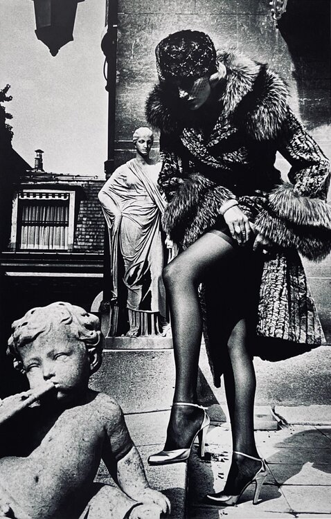 Woman in Coat Adjusting Stocking, Paris 1975 Helmut Newton