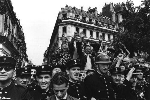 Crowds fill up the Champs Elysees on the 26th August 1944 to celebrate the liberation of Paris. van Robert Capa, Fotografie te koop op Singulart