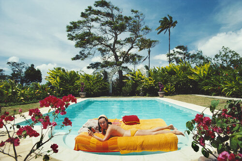 Slim Aarons 'Sunbathing In Barbados' van Slim Aarons, Fotografie te koop op Singulart