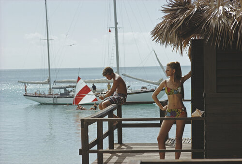 Slim Aarons 'Fishing On Honeymoon Porch' by Slim Aarons, Photography for Sale on Singulart