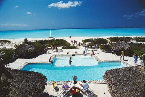 Slim Aarons 'Swimming Pool On The Beach' by Slim Aarons, Photography for Sale on Singulart