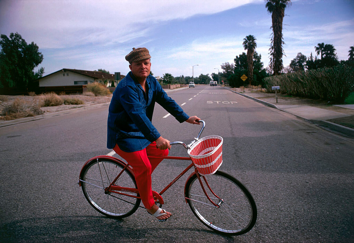 Slim Aarons 'Cycling Capote' Slim Aarons Fotografia in vendita