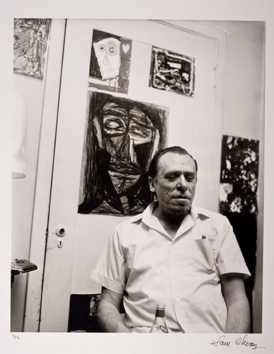 Charles Bukowski (De Longpre St. Apt. w/Bukowski's art in the background) par Sam Cherry, Photographie en vente sur Singulart