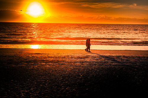 “Edge of Eternity: Sunset Silhouettes and Ocean Flame” Karlton McIver