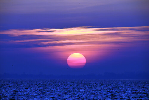 Sonnenuntergang im Meer par Klaus Schreiber, Photographie en vente sur Singulart