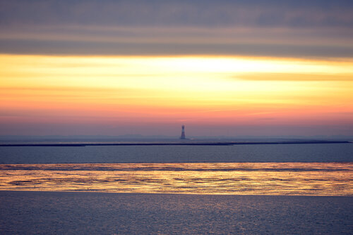Mystischer Sonnenaufgang mit Leuchtturm by Klaus Schreiber, Photography for Sale on Singulart