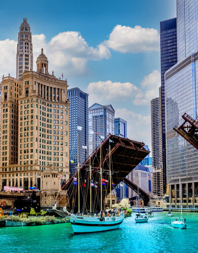 Chicago's Tall Windy Ship is passing under Magnificent Mile Bridges During Summer Season Opener van Lev Kaytsner, Fotografie te koop op Singulart
