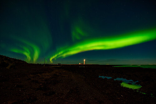 Northern Lights in Seltjarnarnes Lighthouse, Iceland van Luigi Morbidelli, Fotografie te koop op Singulart