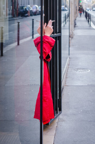 Scarlet cigarette break Place St Georges in Paris by Yann Gourvennec, 사진 for Sale on Singulart