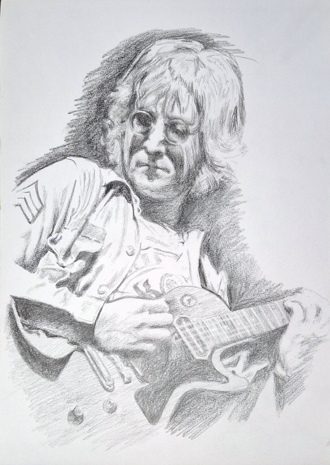 Jon Lennon with guitar. Jon Hillier
