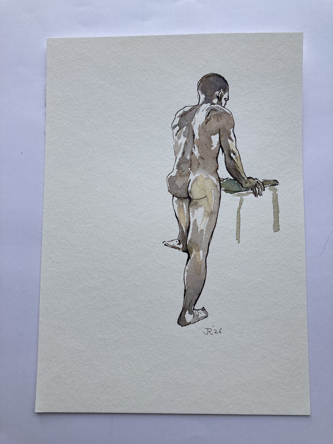 Manu standing from the back John Rabou