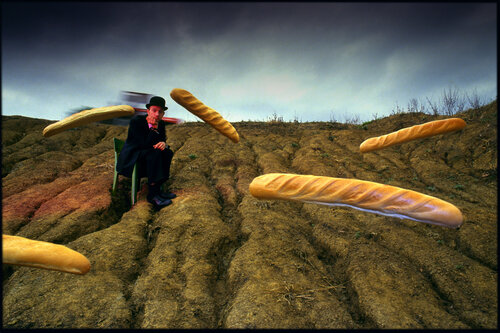 Portrait of a man selling fresh bread directly from soil. par Matjaz Preseren, Photographie en vente sur Singulart